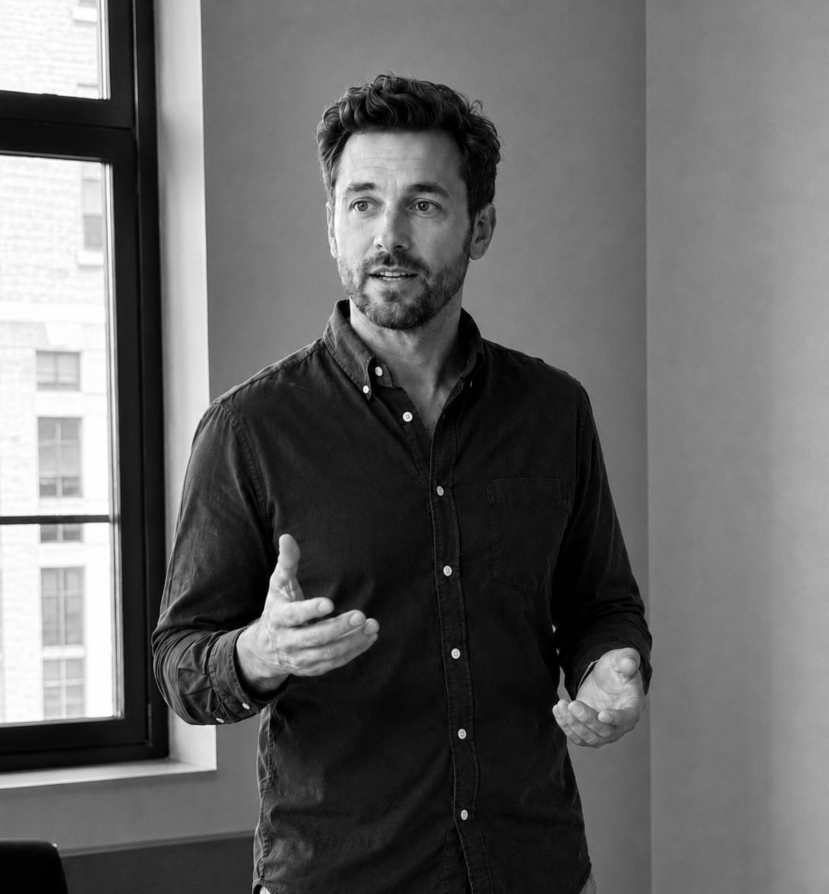 Mark Southgate speaking in an office